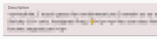 A close-up of the "Description" field, a long-entry text box, with the contents blurred.